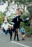 Parade led by the giant puppets of the Griffins at the Walter Burley Griffin & Marion Mahony Griffin Festival, Castlecrag, 1995